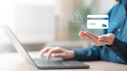 A person using a laptop with virtual warning icons and a credit card symbol, representing fraud alerts and secure transaction monitoring. Suspicious charge fraud alert secure transaction protection.