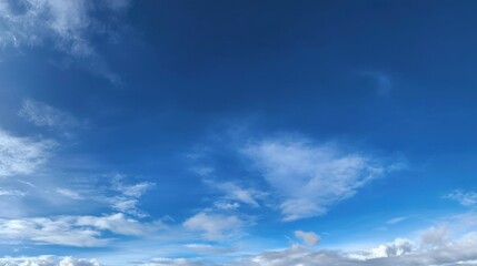 The sky is blue and clear with no clouds. The sun is shining brightly, making the sky look even brighter. Scene is peaceful and serene, as if the world is at rest