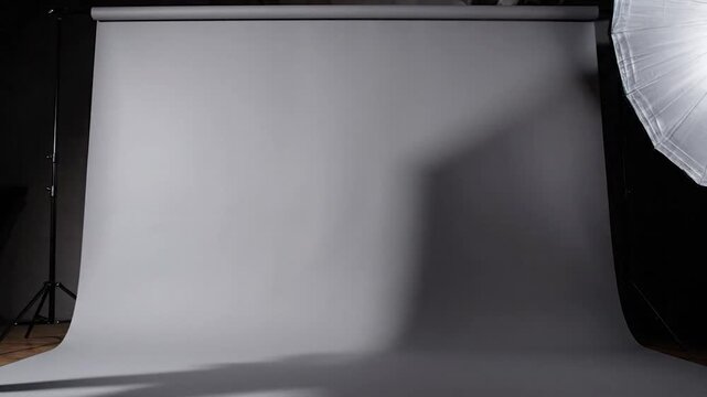 Empty photography studio backdrop with soft lighting setup