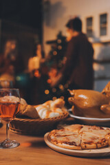 Festive Office Christmas Party with Delicious Food. A beautifully decorated office space with Christmas trees and festive lights, set up for a holiday party.