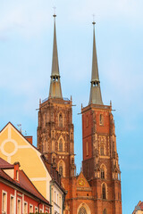 Gothic cathedral towers against blue sky. The St. John the Baptist Archcathedral in Wrocław