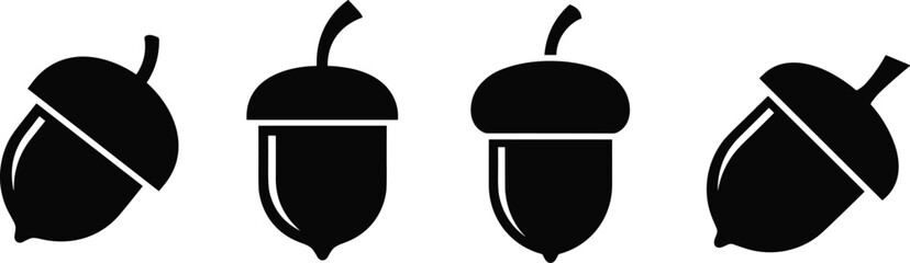 Four black silhouette acorns with caps on white background vector © Mokarrm Art