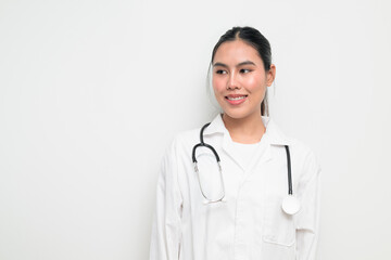 Fototapeta premium Thoughtful Happy Woman Doctor with Stethoscope in White Uniform on Plain Background Smiling