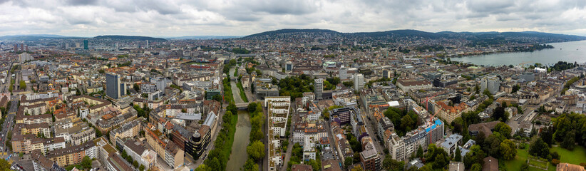 Fototapeta premium Aerial panoramic view of the city Zürich in Switzerland on a cloudy morning day in summer