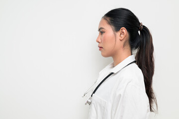 Profile View of Woman Doctor with Stethoscope in White Uniform on Plain Background