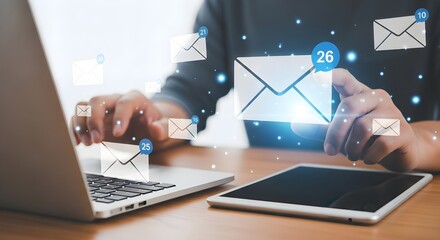 Digital Communication: Person interacting with email notifications on laptop and tablet, concept of online messaging and connectivity