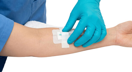 Medical professional securing IV catheter in patient's arm with aseptic technique and care