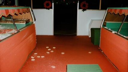 Dark Chirstmas Empty vendor stall with scattered debris and dim lighting.