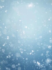 Fototapeta premium Abstract winter background with soft falling snowflakes on a light blue gradient backdrop creating a peaceful seasonal atmosphere
