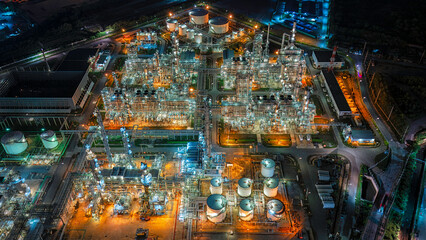 Aerial view oil refinery plant at night.