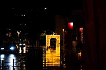 Night view of the central square in Durrës, Albania, decorated with festive Christmas and New Year lights.