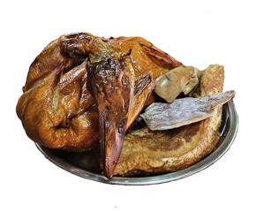 Isolated studio image of traditional Chinese New Year offerings featuring a whole roasted duck, sliced roasted pork, and dried squid for ancestral worship and festive ritual use.