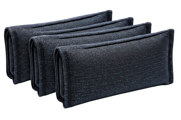 Naklejka premium Row of three folded black textured fabric pouches on a transparent background