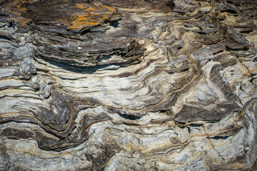 brown stone or rock background and texture, abstract background of rocky formation with uneven texture