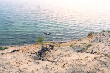 Blue morning light over the Baltic coast of Rügen with a calm sea view creating a dreamy panoramic seascape and soft cloudscape in pure nature