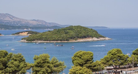 Obraz premium Panoramic Ksamil coastline with turquoise Ionian Sea and islands in Albania on a sunny summer day