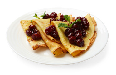 Tasty crepes with cherries and mint isolated on white
