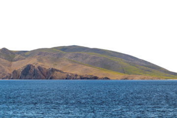 Serene coastal landscape with rolling hills and blue ocean. Isolated object.