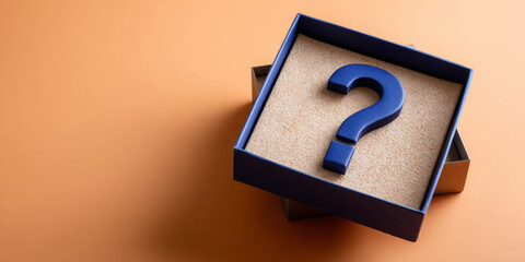 Blue question mark symbol inside an open gift box on a beige textured surface with orange background
