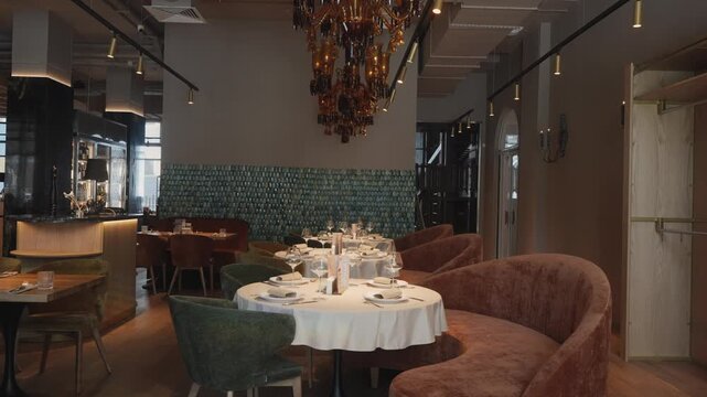 Sophisticated dining setup featuring sparkling glasses and intimate warm illumination for special evenings