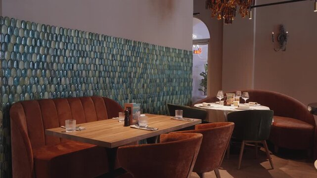 Comfortable seating with warm lighting, Inviting dining space featuring elegant decor and ambiance