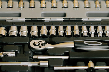 Set of tools with various sizes arranged in a toolbox for mechanical work tasks