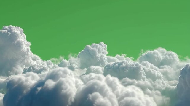 Fluffy white clouds gracefully morph against a vibrant green sky, showcasing a dynamic dance of nature amidst changing weather