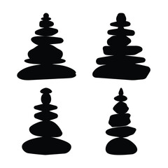 Four balanced stone stacks in silhouette representing harmony