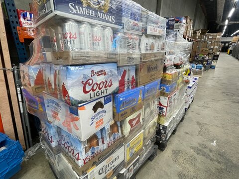 Grocery store beer delivery shrink wrapped pallet various brands