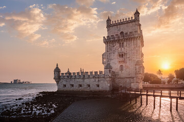 Belem Tower or Tower of St Vincent - famous tourist landmark of Lisboa and tourism attraction - on the bank of the Tagus River Tejo on sunset. Lisbon, Portugal