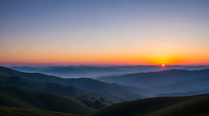 Sunrise over misty mountain valleys