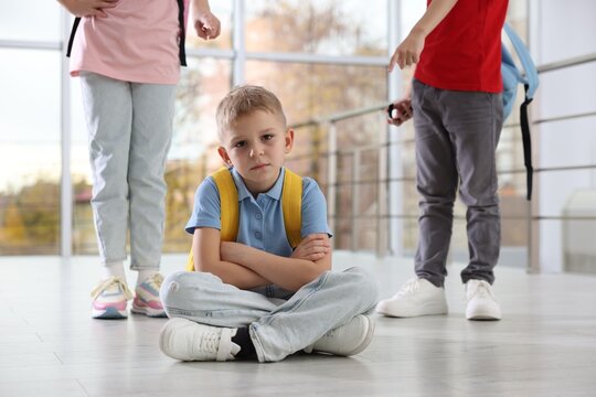 Boy getting bullied by his classmates in school, closeup - Powered by Adobe