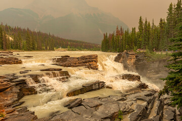 Athabasca Falls with wildfires smoke, Jasper national park, Canada.