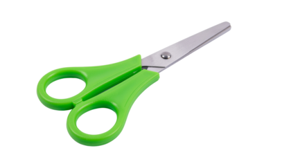 Green handled scissors with silver blades are visible in a close up shot on a white surface transparent background and plain white background