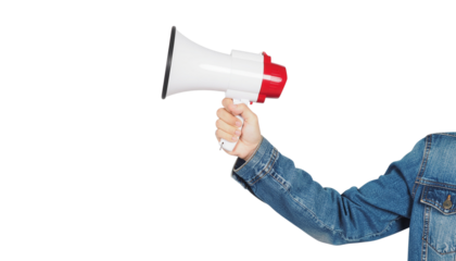 Hand holding a white and red megaphone with a denim jacket sleeve visible, arm extended upwards isolated on white
