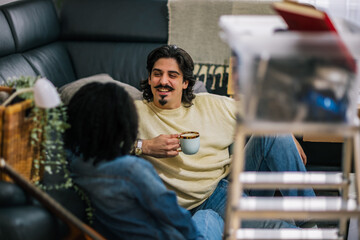 Couple enjoying coffee in new home
