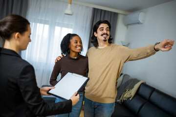 Couple touring apartment with real estate agent