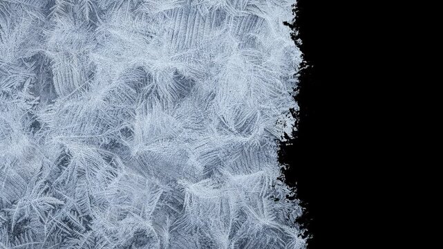 Glass freezing effect ice formation process winter frost time lapse horizontal animation on black chroma key alpha channel background
