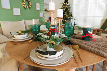 Festive table setting with Christmas decor indoors, closeup