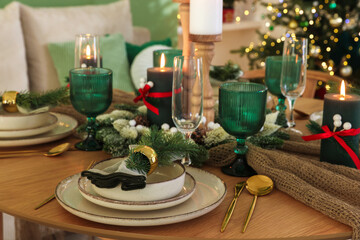Festive table setting with Christmas decor indoors, closeup