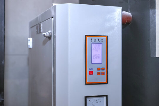 Digital display increases process stability. Annealing - Heat Treatment Furnaces . Industrial furnace with advanced control panel provides precise temperature control in production. - Powered by Adobe
