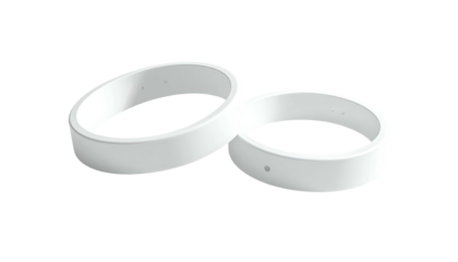 Two white, circular bands, slightly angled, overlap against a black background. The bands have small holes and are smooth