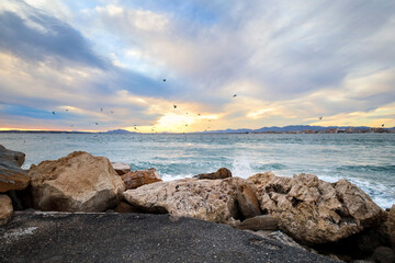 Beautiful view of the sea from a breakwater at sunset