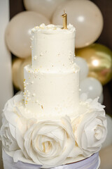 A cake for a child's first birthday with the number one