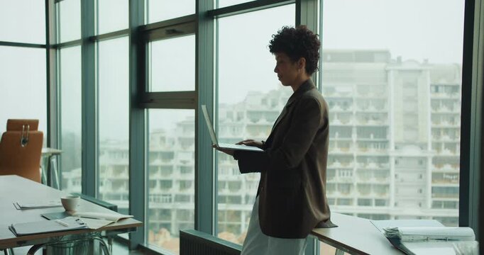Business leader analyzing project timeline near city skyline