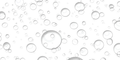 Clear transparent bubbles of various sizes floating on a clean white background