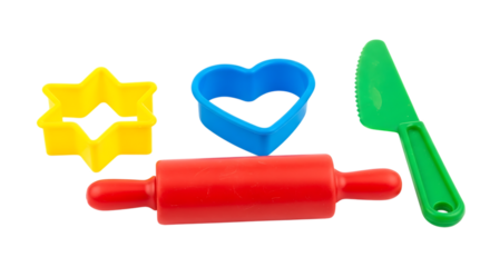 Red rolling pin yellow star blue heart cookie cutters and green knife