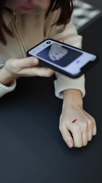 Vertical screen girl shows a fresh cut on her hand to ChatGPT asking what to do next as she worries about the bleeding and seeks quick guidance on treating the small but painful injury