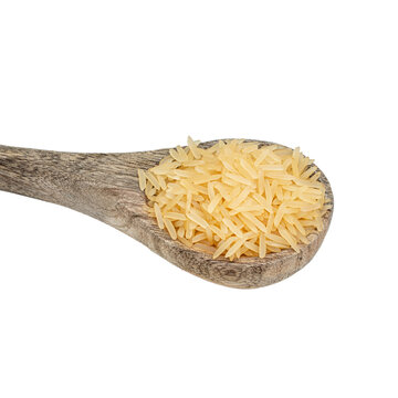 Wooden spoon with boiled rice on a white isolated background