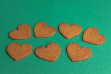 gingerbread hearts on a green background